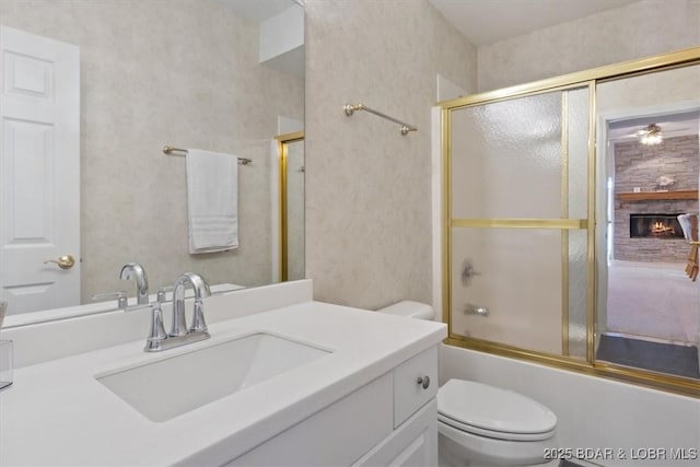 26 Port Bagnell Rd, Eldon, MO 65026 - full bath featuring vanity, combined bath / shower with glass door, and a large fireplace