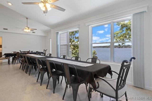 26 Port Bagnell Rd, Eldon, MO 65026 - dining area featuring ceiling fan, vaulted ceiling, healthy amount of natural light, a water view, and light tile patterned floors