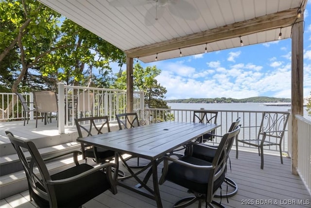 26 Port Bagnell Rd, Eldon, MO 65026 - wooden terrace featuring outdoor dining space and a water view