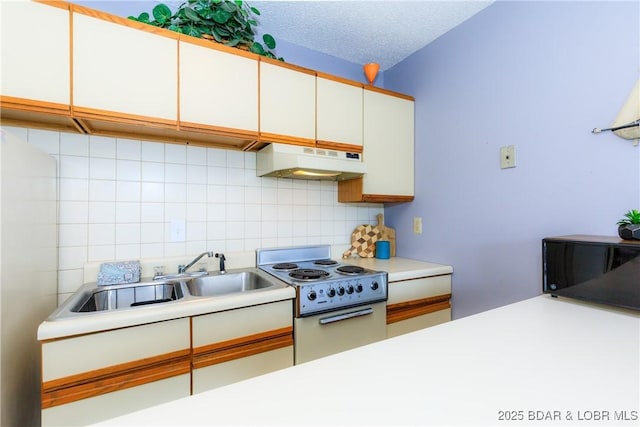 1442 Nichols Rd Unit D301, Osage Beach, MO 65065 - kitchen featuring range hood, stove, backsplash, and light countertops