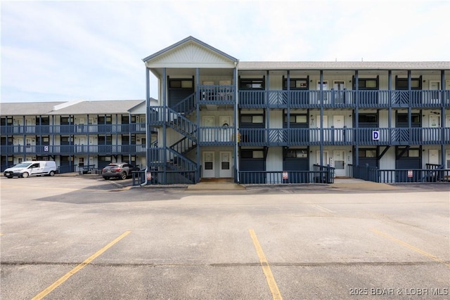 1442 Nichols Rd Unit D301, Osage Beach, MO 65065 - view of apartment building / complex with uncovered parking