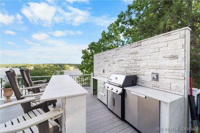 584 Black Hawk Dr, Lake Ozark, MO 65049 - wooden terrace with a grill and outdoor dining area