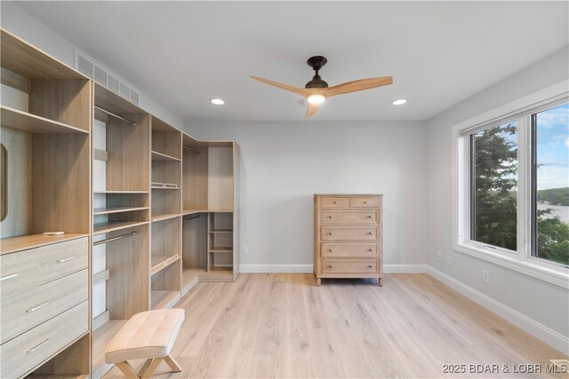 584 Black Hawk Dr, Lake Ozark, MO 65049 - spacious closet featuring ceiling fan and light wood-style floors