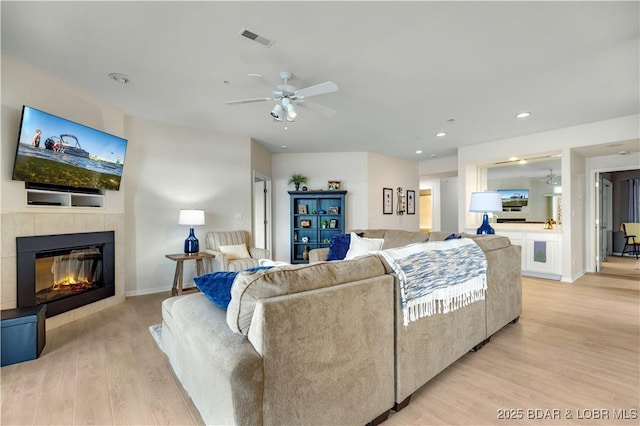 5450 Christopher Ln Unit 211, Osage Beach, MO 65065 - living room with ceiling fan, light wood-style floors, a fireplace, and recessed lighting