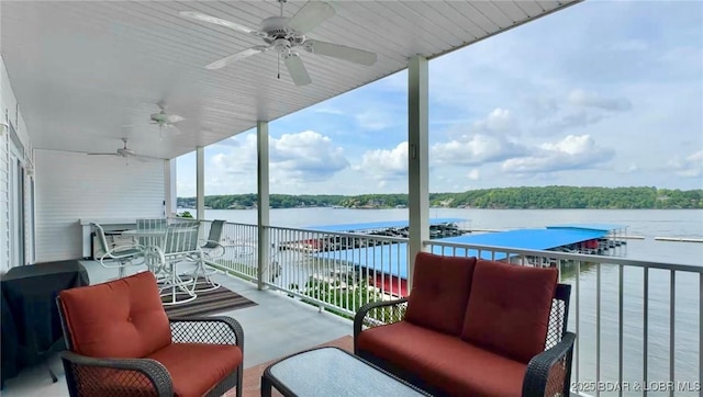 5450 Christopher Ln Unit 211, Osage Beach, MO 65065 - balcony with a ceiling fan, an outdoor living space, and a water view