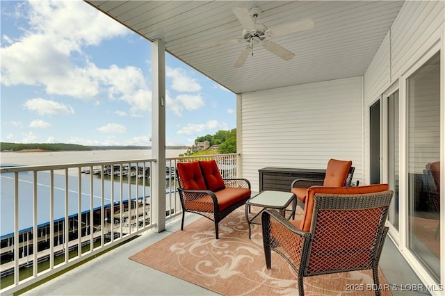 5450 Christopher Ln Unit 211, Osage Beach, MO 65065 - balcony featuring ceiling fan and a water view