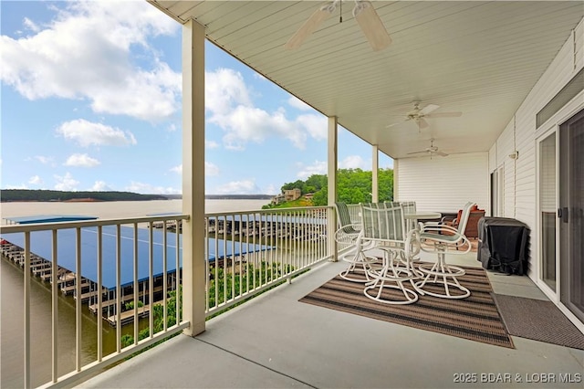 5450 Christopher Ln Unit 211, Osage Beach, MO 65065 - balcony featuring a ceiling fan, a water view, outdoor dining space, and area for grilling