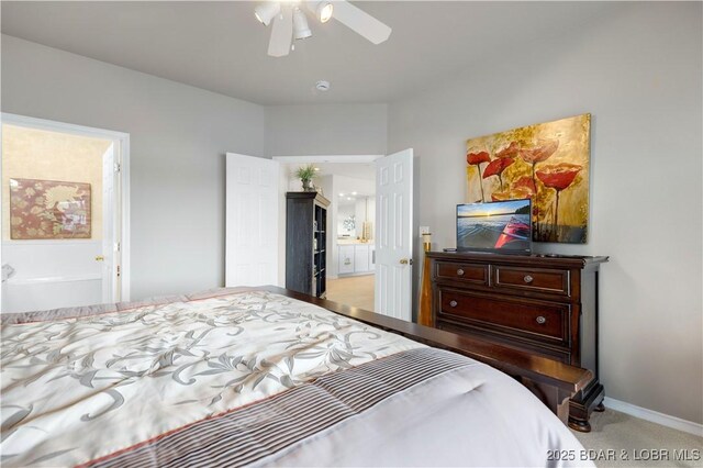5450 Christopher Ln Unit 211, Osage Beach, MO 65065 - carpeted bedroom with a ceiling fan and ensuite bathroom