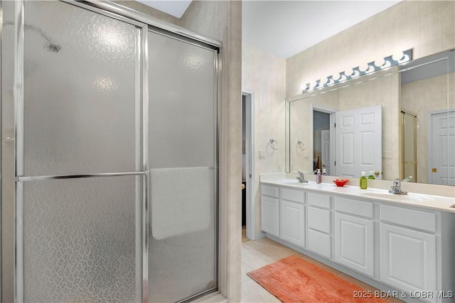 5450 Christopher Ln Unit 211, Osage Beach, MO 65065 - bathroom with a shower stall, double vanity, and tile patterned flooring
