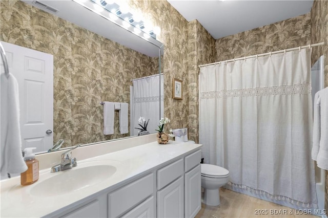5450 Christopher Ln Unit 211, Osage Beach, MO 65065 - full bathroom featuring wallpapered walls and vanity