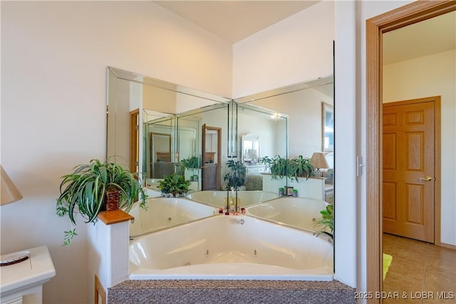 49 Aqua Fin Dr Unit 3B, Lake Ozark, MO 65049 - bathroom with a jetted tub and tile patterned floors