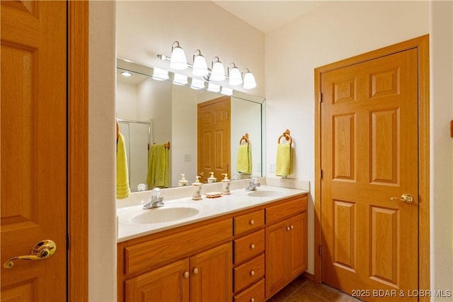 49 Aqua Fin Dr Unit 3B, Lake Ozark, MO 65049 - bathroom with double vanity, tile patterned flooring, and a stall shower