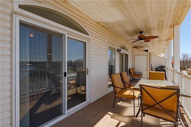 49 Aqua Fin Dr Unit 3B, Lake Ozark, MO 65049 - balcony with ceiling fan and outdoor dining space