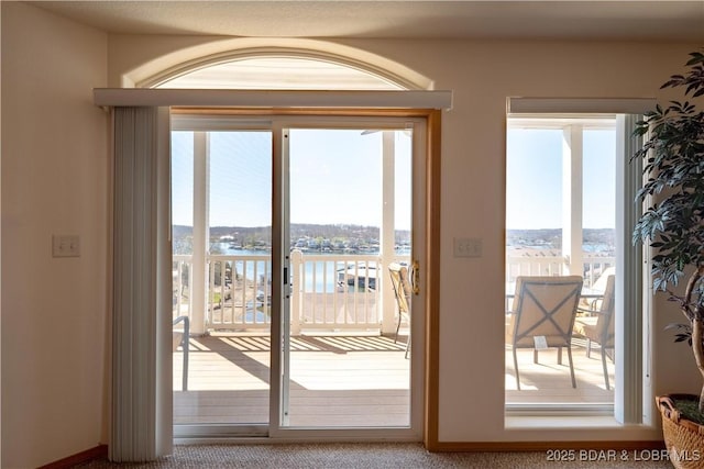 49 Aqua Fin Dr Unit 3B, Lake Ozark, MO 65049 - doorway to outside featuring a water view and healthy amount of natural light