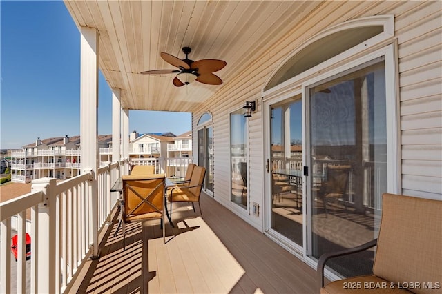 49 Aqua Fin Dr Unit 3B, Lake Ozark, MO 65049 - balcony with ceiling fan and a residential view