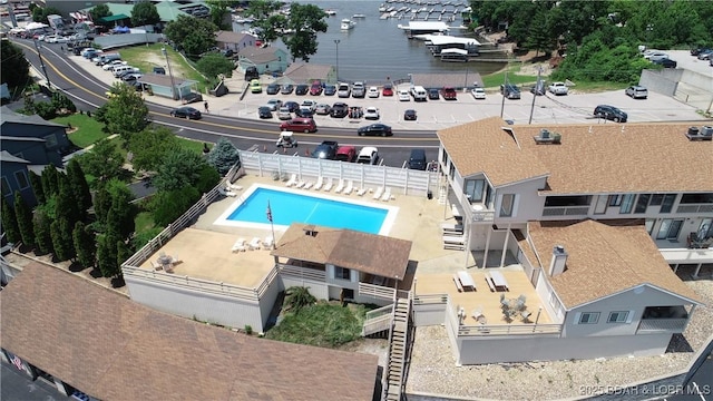 49 Aqua Fin Dr Unit 3B, Lake Ozark, MO 65049 - bird's eye view of a pool and a large body of water