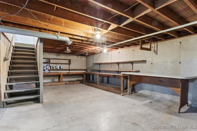 43 Bob White Ln, Lake Ozark, MO 65049 - unfinished below grade area featuring a workshop area and stairs