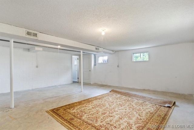 43 Bob White Ln, Lake Ozark, MO 65049 - below grade area featuring a textured ceiling