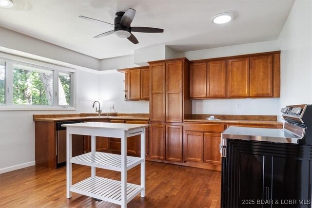 43 Bob White Ln, Lake Ozark, MO 65049 - kitchen featuring brown cabinetry, dishwasher, wood finished floors, and ceiling fan
