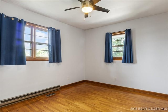 43 Bob White Ln, Lake Ozark, MO 65049 - spare room with a baseboard radiator, light wood-style floors, and ceiling fan