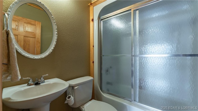 15350 Red Hollow Rd, Gravois Mills, MO 65037 - bathroom with shower / bath combination with glass door and a textured wall