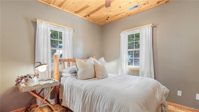 15350 Red Hollow Rd, Gravois Mills, MO 65037 - bedroom featuring multiple windows, wood finished floors, and wooden ceiling