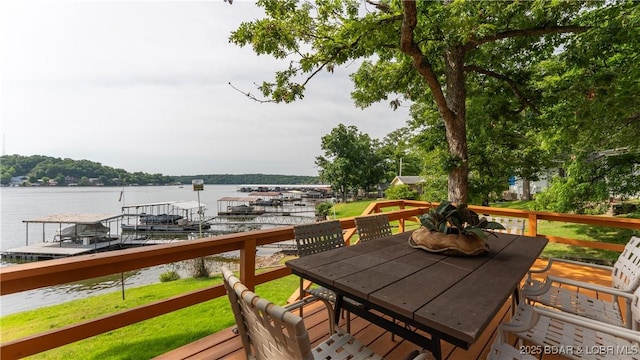 15350 Red Hollow Rd, Gravois Mills, MO 65037 - wooden deck featuring a water view, a yard, outdoor dining space, and a dock