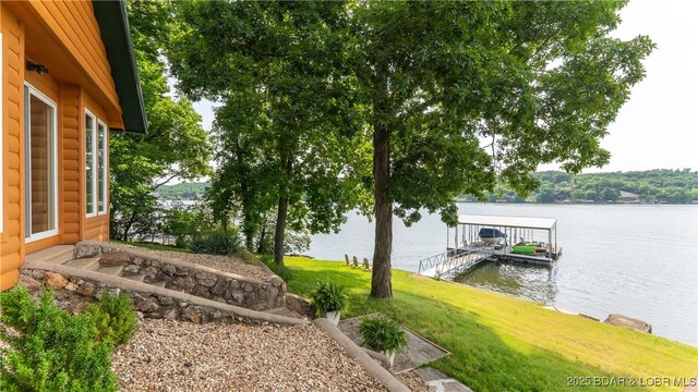 15350 Red Hollow Rd, Gravois Mills, MO 65037 - view of green lawn with a water view and a floating dock
