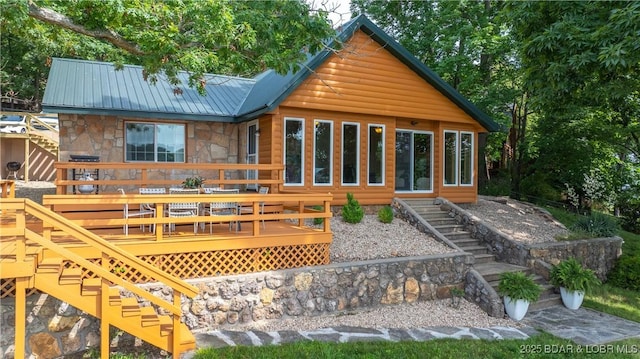 15350 Red Hollow Rd, Gravois Mills, MO 65037 - rear view of property with stairs, stone siding, a wooden deck, and a metal roof