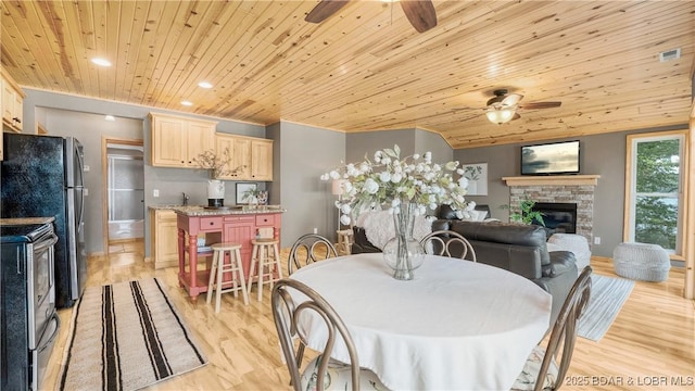 15350 Red Hollow Rd, Gravois Mills, MO 65037 - dining room featuring ceiling fan, a fireplace, wooden ceiling, light wood-type flooring, and recessed lighting