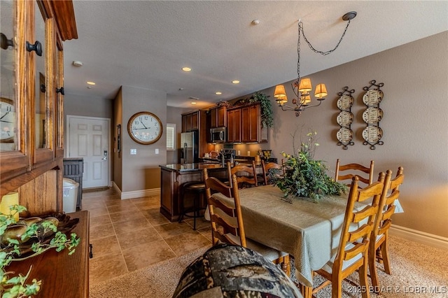 730 Flame Dr Unit 3C, Camdenton, MO 65020 - dining space with a chandelier, recessed lighting, and a textured ceiling