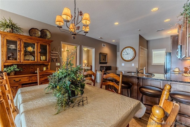 730 Flame Dr Unit 3C, Camdenton, MO 65020 - dining room featuring recessed lighting, a chandelier, and a textured ceiling
