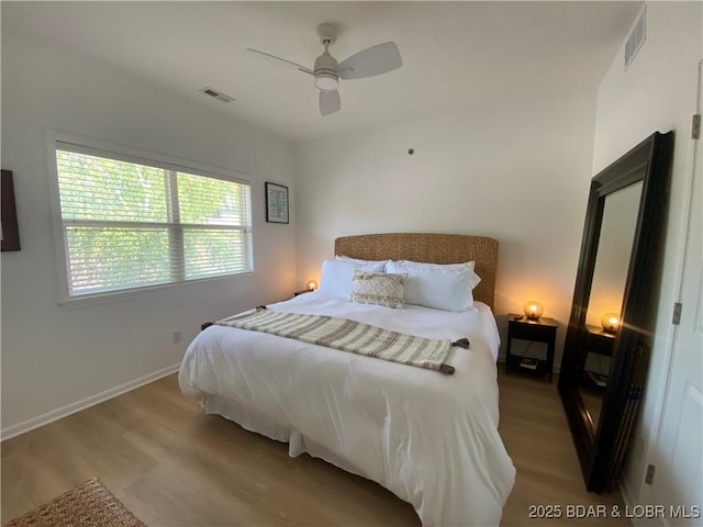 42 Palisades Lakeview Dr Unit 4B, Lake Ozark, MO 65049 - bedroom featuring wood finished floors and a ceiling fan