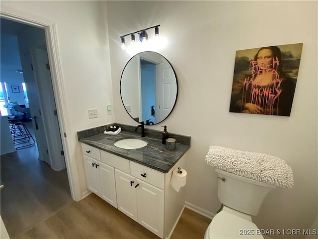42 Palisades Lakeview Dr Unit 4B, Lake Ozark, MO 65049 - bathroom featuring vanity and wood finished floors