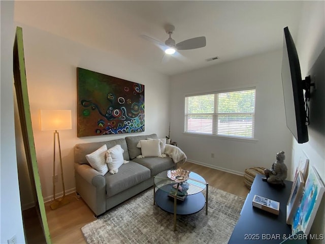 42 Palisades Lakeview Dr Unit 4B, Lake Ozark, MO 65049 - living area with wood finished floors and ceiling fan