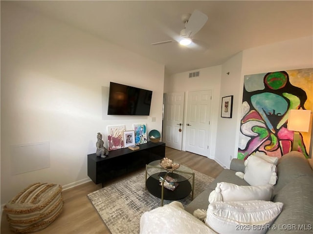 42 Palisades Lakeview Dr Unit 4B, Lake Ozark, MO 65049 - living area with wood finished floors, a ceiling fan, and lofted ceiling