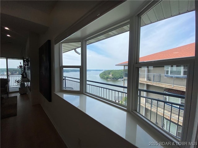 42 Palisades Lakeview Dr Unit 4B, Lake Ozark, MO 65049 - hall with a water view and dark wood-style flooring