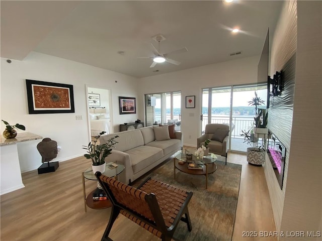42 Palisades Lakeview Dr Unit 4B, Lake Ozark, MO 65049 - living area featuring wood finished floors, a ceiling fan, and recessed lighting