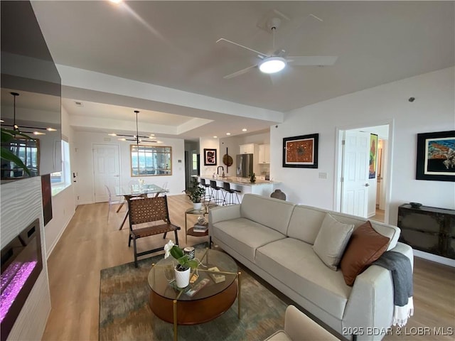42 Palisades Lakeview Dr Unit 4B, Lake Ozark, MO 65049 - living room with ceiling fan and light wood-style flooring