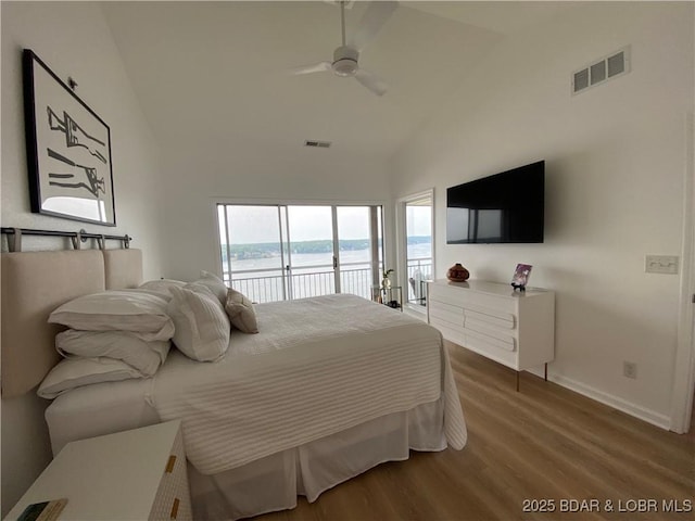 42 Palisades Lakeview Dr Unit 4B, Lake Ozark, MO 65049 - bedroom featuring access to exterior, high vaulted ceiling, wood finished floors, and a ceiling fan