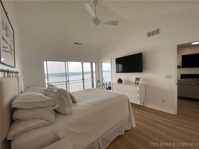 42 Palisades Lakeview Dr Unit 4B, Lake Ozark, MO 65049 - bedroom featuring access to outside, high vaulted ceiling, wood finished floors, and ceiling fan