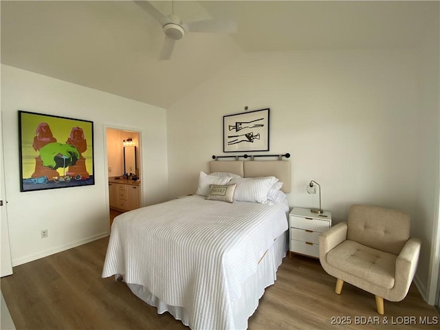 42 Palisades Lakeview Dr Unit 4B, Lake Ozark, MO 65049 - bedroom with wood finished floors, vaulted ceiling, ensuite bathroom, and a ceiling fan