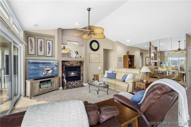 6680 Keystone Dr Unit 241, Osage Beach, MO 65065 - carpeted living room featuring a ceiling fan, healthy amount of natural light, lofted ceiling, and a tiled fireplace