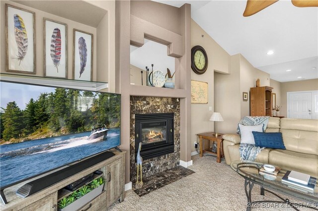 6680 Keystone Dr Unit 241, Osage Beach, MO 65065 - living area featuring carpet, a tile fireplace, ceiling fan, and vaulted ceiling