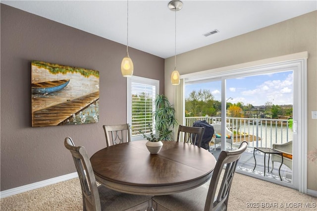6680 Keystone Dr Unit 241, Osage Beach, MO 65065 - dining space featuring light carpet and a textured wall