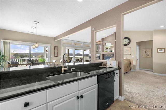 6680 Keystone Dr Unit 241, Osage Beach, MO 65065 - kitchen featuring black dishwasher, light colored carpet, white cabinetry, hanging light fixtures, and dark stone counters