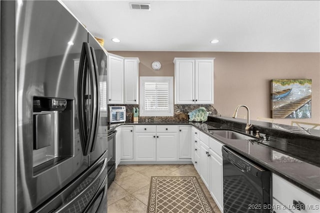 6680 Keystone Dr Unit 241, Osage Beach, MO 65065 - kitchen featuring stainless steel fridge with ice dispenser, dishwasher, white cabinets, dark stone countertops, and recessed lighting