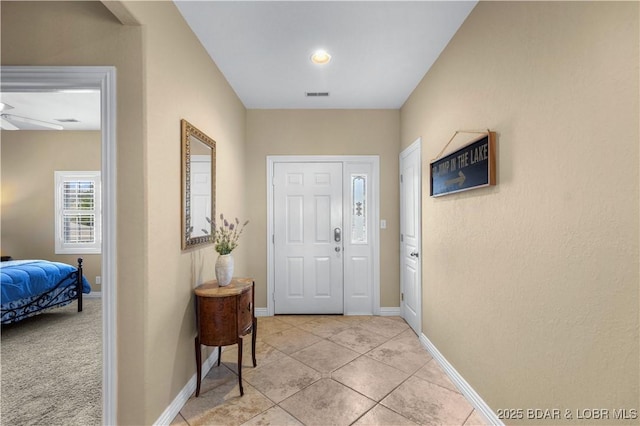 6680 Keystone Dr Unit 241, Osage Beach, MO 65065 - foyer entrance with ceiling fan and light tile patterned floors
