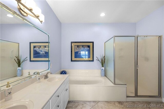 6680 Keystone Dr Unit 241, Osage Beach, MO 65065 - bathroom featuring double vanity, a shower stall, a whirlpool tub, tile patterned floors, and recessed lighting