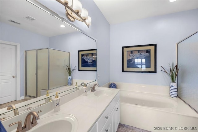 6680 Keystone Dr Unit 241, Osage Beach, MO 65065 - bathroom with double vanity, a whirlpool tub, tile patterned floors, and recessed lighting